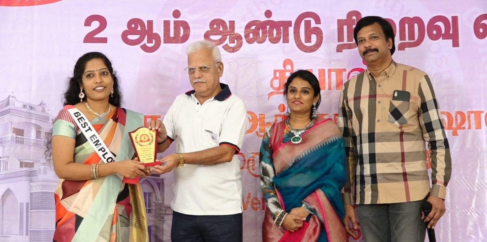 Mrs. Mathi receiving the Best Employee Award, Nursing Department